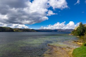 Breathtaking view of Lake Tota in Boyacá, Colombia, with mountains and clouds.